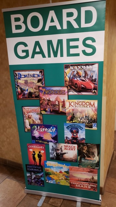 A picture of a banner sign saying Board Games with pictures of previous Spiel des Jahres winners.